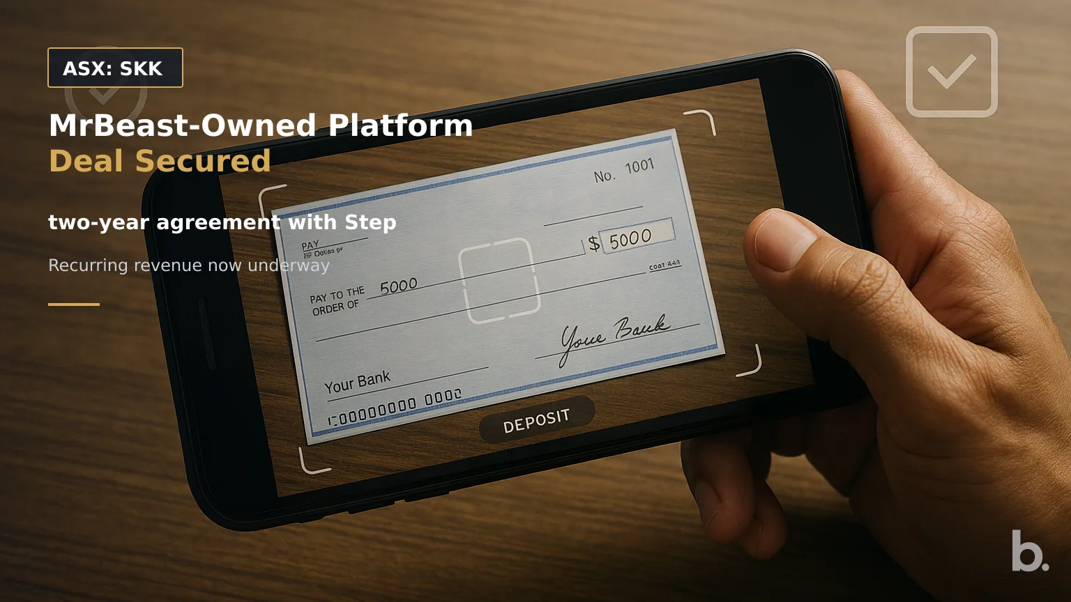 [ASX: SKK] STAKK LIMITED a smartphone held above a paper cheque during a mobile deposit, with the camera interface framing the cheque