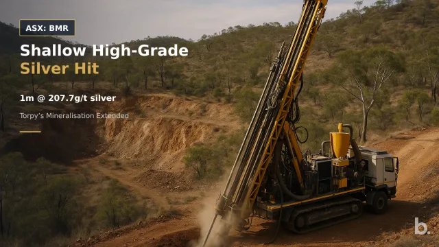 [ASX: BMR] BALLYMORE RESOURCES LIMITED a reverse-circulation drill rig operating beside the historic Torpy’s mine workings in rugged North Queensland bushland, framed